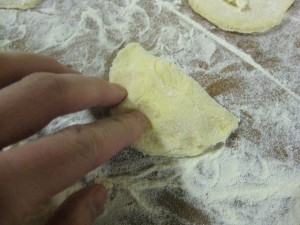 making pirohy by folding dough over
