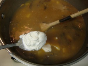 mushroom soup with a spoonful of sourcream