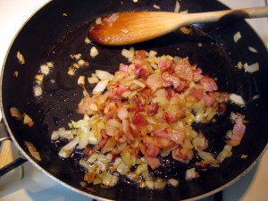 frying onion on bacon