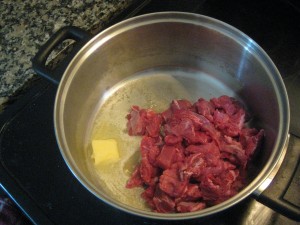 beef browning in a pot