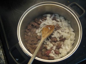 making goulash: beef with onion