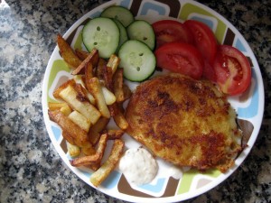 fried cheese with fries, cucumbers and tomatoes
