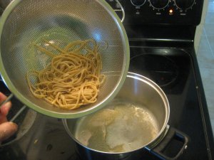 combine spaghetti with melted butter