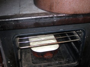 baking bread in wood burning over