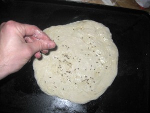 salt and caraway on dough