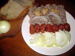 Slovak tlacenka or pressed meat with smoked sausage and onions