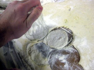 cutting pierogi with drinking glass