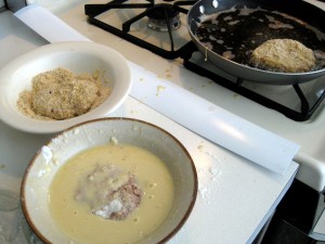 assembly line for covering and frying hamburgers