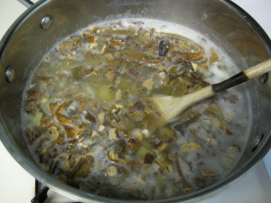 pot with water potatoes and mushrooms