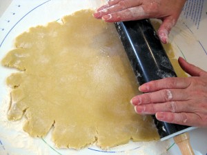 rolling out shortbread cookie dough