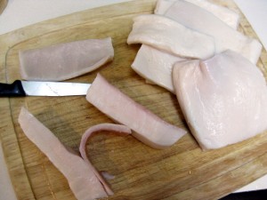 cutting skin off pork rinds