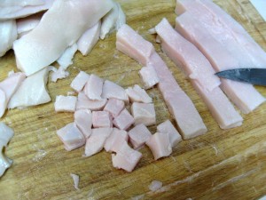 slicing lard into cubes