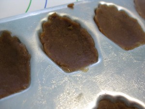 close up of Madeleine dough in baking mold