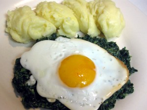 spinach with fried egg and mashed potatoes