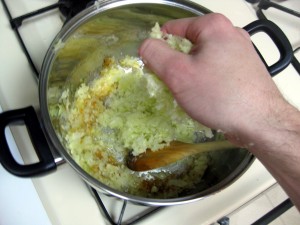 adding cabbage to frying pan