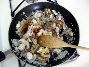 onions mushrooms bacon frying on oil