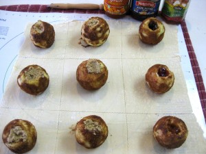 puff pastry dough cut into squares with stuffed apples