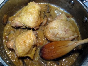 chicken cooking in sauce