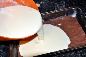 pouring cake filling over dough