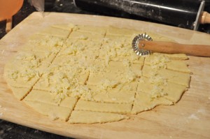cheese bread dough covered with grated cheese