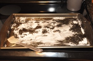 greased baking pan dusted with flour