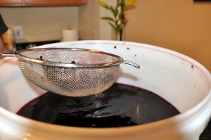 straining grape skins