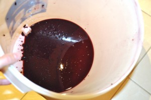 gunk at the bottom of wine fermenter