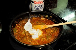 vegetable stew with a spoon of sour cream