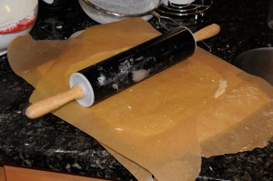rolling out dough using wax paper
